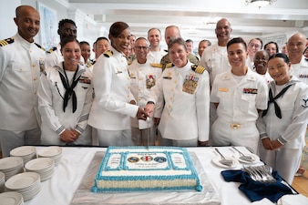 (VIRIN: 260603-N-LY941-1016)

GUANTANAMO BAY, Cuba (June 3, 2026) Capt. Toni A. Bowden and Capt. Tammy E. Servies prepare to cut a ceremonial cake following their change of command ceremony at the Bayview aboard Naval Station Guantanamo Bay, June 3, 2026. During the ceremony, Bowden assumed the roles of commanding officer, U.S. Navy Medicine Readiness and Training Command Guantanamo Bay; commander, Joint Medical Group, Joint Task Force Guantanamo; and director, U.S. Naval Hospital Guantanamo Bay. (U.S. Navy photo by Emily McCamy)