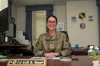 U.S. Air Force Col. Kelli R. Moon, commander of the 11th Operations Group at Joint Base Anacostia-Bolling, sits at her desk at JBAB, Washington, D.C. May 27, 2026. Moon has commanded the 11th Operations Group at JBAB since 2024, which oversees the U.S. Air Force Honor Guard, U.S. Air Force Band, Air Force Chaplaincy at Arlington National Cemetery, and the Air Force Memorial.  (U.S. Air Force photo by Senior Airman Shanel Toussaint)