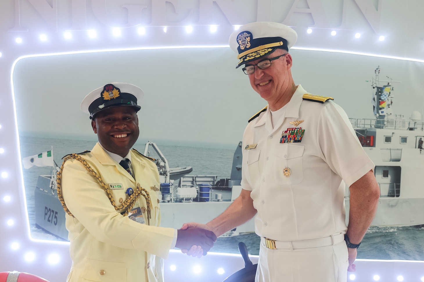 U.S. Navy Rear Adm. Scott W. Ruston, right, Vice Commander of U.S. Naval Forces Africa, and Nigerian Navy Sub-Lieutenant Hillary Ifeanyi  Azegba, left, assigned to Western Naval Command, pose for a photo at the Sea Power for Africa Symposium, during the Nigerian Navy’s 70th Anniversary Celebration in Victoria Island, Lagos, Nigeria June 2, 2026.
