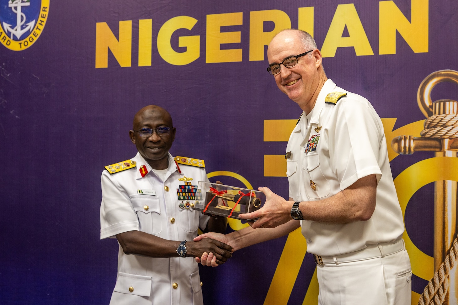 Nigerian Navy Vice Adm. Idi Abbas, left, Chief of Naval Staff, presents a gift to U.S. Navy Rear Adm. Scott W. Ruston, Vice Commander of U.S. Naval Forces Africa, at the Sea Power for Africa Symposium, during the Nigerian Navy’s 70th Anniversary Celebration in Lagos, Nigeria June 2, 2026.