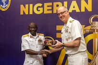 Nigerian Navy Vice Adm. Idi Abbas, left, Chief of Naval Staff, presents a gift to U.S. Navy Rear Adm. Scott W. Ruston, Vice Commander of U.S. Naval Forces Africa, at the Sea Power for Africa Symposium, during the Nigerian Navy’s 70th Anniversary Celebration in Lagos, Nigeria June 2, 2026.