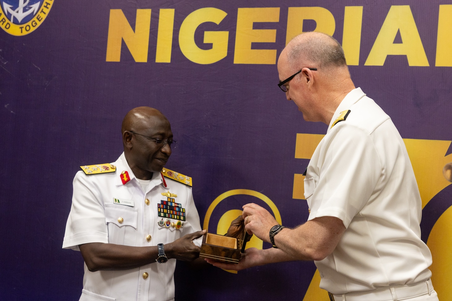 Nigerian Navy Vice Adm. Idi Abbas, left, Chief of Naval Staff, presents a gift to U.S. Navy Rear Adm. Scott W. Ruston, Vice Commander of U.S. Naval Forces Africa, at the Sea Power for Africa Symposium, during the Nigerian Navy’s 70th Anniversary Celebration in Lagos, Nigeria June 2, 2026.