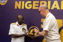U.S. Navy Rear Adm. Scott W. Ruston, Vice Commander of U.S. Naval Forces Africa, right, presents a gift to Nigerian Navy Vice Adm. Idi Abbas, Chief of Naval Staff, at the Sea Power for Africa Symposium, during the Nigerian Navy’s 70th Anniversary Celebration in Lagos, Nigeria, June 2, 2026.
