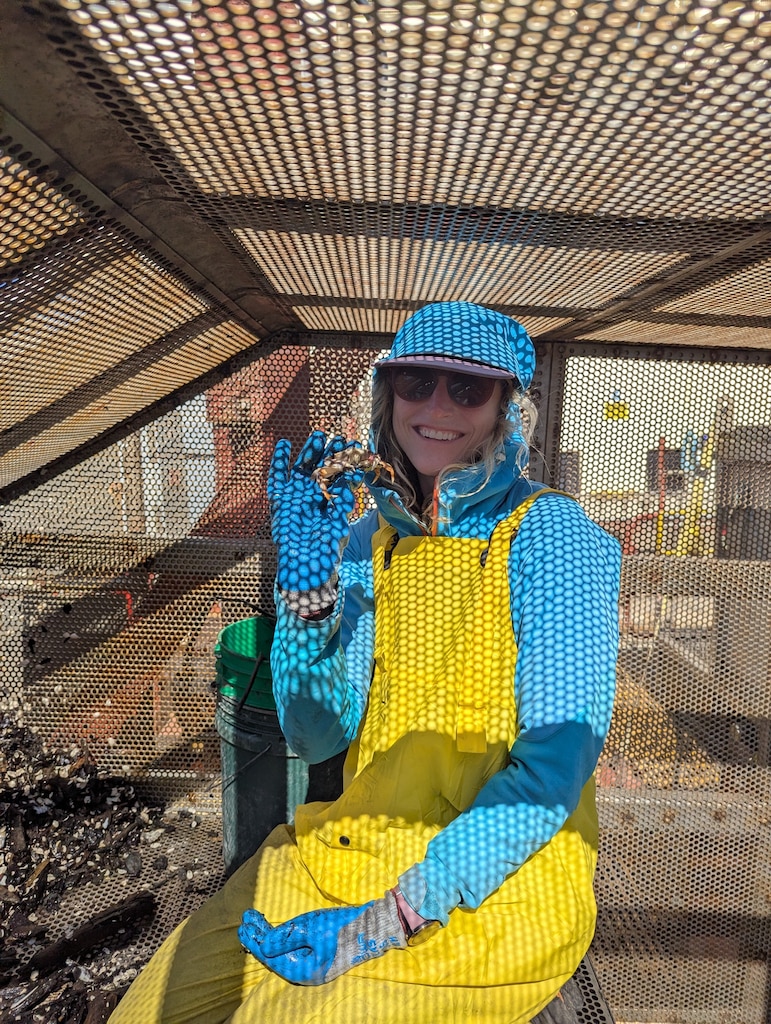 Biologist poses with crab.