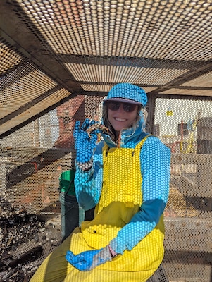 Biologist poses with crab.