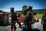 Service members from the New York and New Jersey National Guard Homeland Response Force conduct casualty extraction and hazardous environment response training under the instruction of the West Virginia National Guard during a regional chemical, biological, radiological and nuclear, or CBRN, response exercise. The training focused on lifesaving operations, interagency coordination and rapid response capabilities during large-scale domestic emergencies. Photo by Sgt. Tristan Murry.