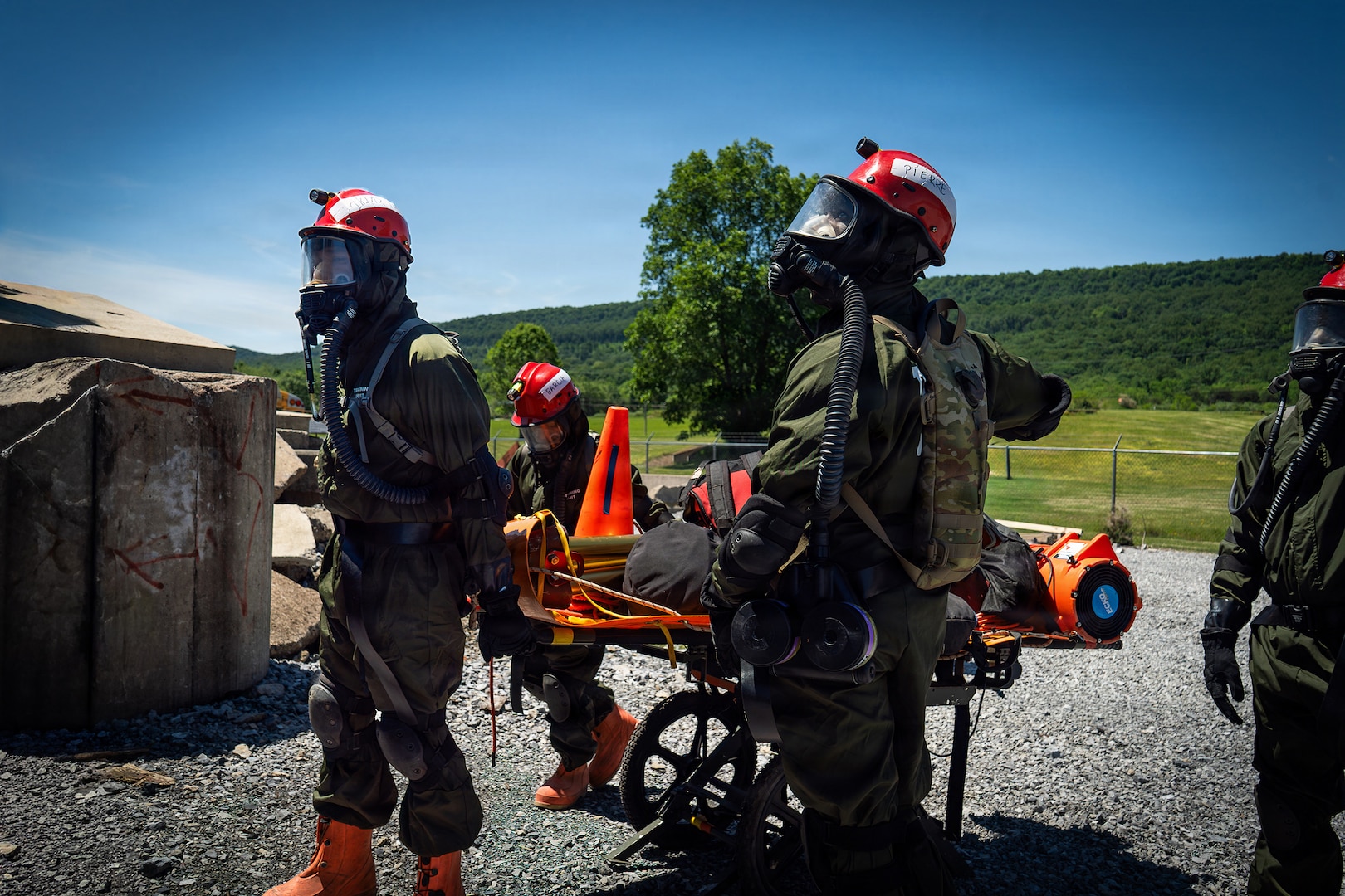 Service members from the New York and New Jersey National Guard Homeland Response Force conduct casualty extraction and hazardous environment response training under the instruction of the West Virginia National Guard during a regional chemical, biological, radiological and nuclear, or CBRN, response exercise.