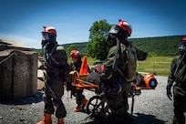 Service members from the New York and New Jersey National Guard Homeland Response Force conduct casualty extraction and hazardous environment response training under the instruction of the West Virginia National Guard during a regional chemical, biological, radiological and nuclear, or CBRN, response exercise.