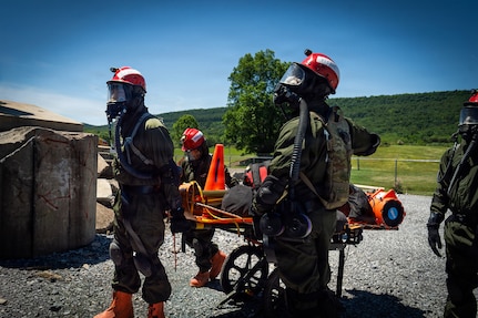 Service members from the New York and New Jersey National Guard Homeland Response Force conduct casualty extraction and hazardous environment response training under the instruction of the West Virginia National Guard during a regional chemical, biological, radiological and nuclear, or CBRN, response exercise.