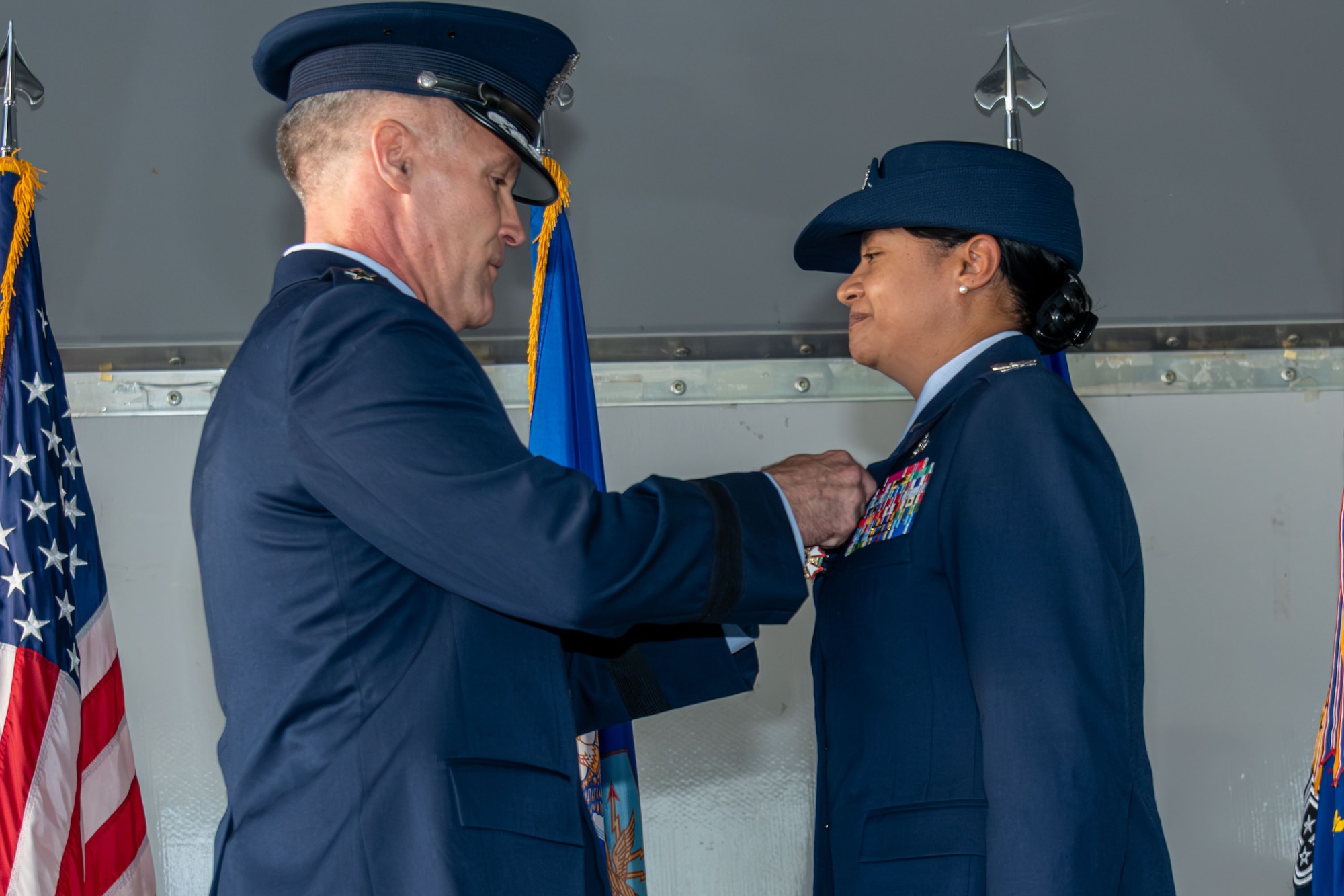 U.S. Air Force Lt. Gen. Daniel H. Tulley, commander and president of Air University presents U.S. Air Force Col. Shamekia Toliver, outgoing commander of the 42nd Air Base Wing, the Legion of Merit medal at Maxwell Air Force Base, Alabama, Jun 6, 2026. The medal is presented for exceptionally meritorious conduct in the performance of outstanding services. (U.S. Air Force photo by Trey Ward)