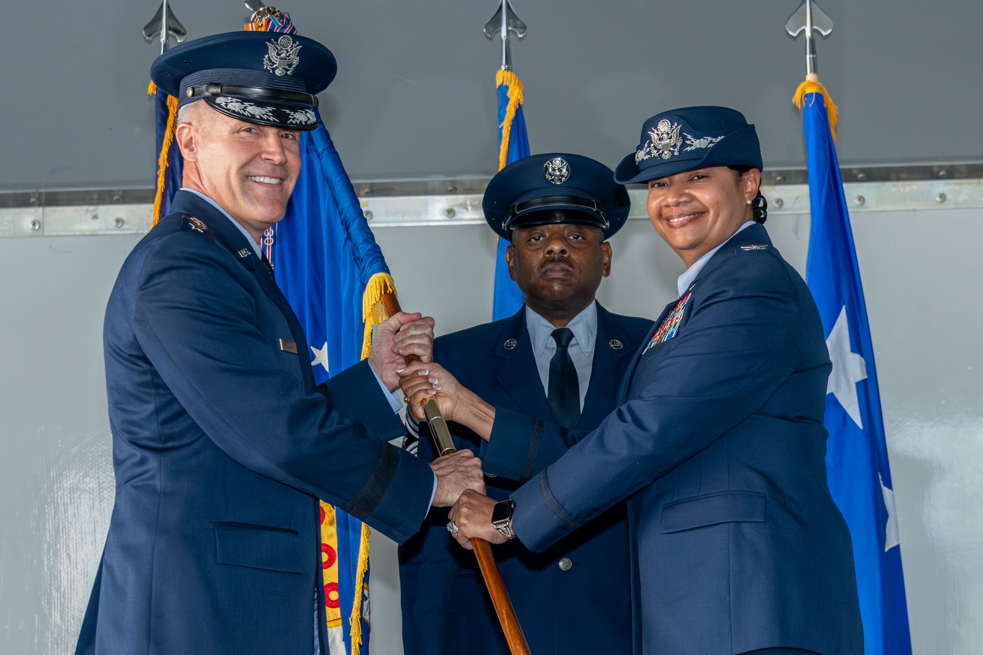 U.S. Air Force Lt. Gen. Daniel H. Tulley, commander and president of Air University receives the guidon from U.S. Air Force Col. Shamekia Toliver, outgoing commander of the 42d Air Base Wing, during the wing’s change of command ceremony at Maxwell Air Force Base, Alabama, Jun 6, 2026. The education and training of our Nation’s fighting forces are critical to the mission success as Team 42 prides itself on providing excellent combat support to Air University and Air Education and Training Command. (U.S. Air Force photo by Trey Ward)
