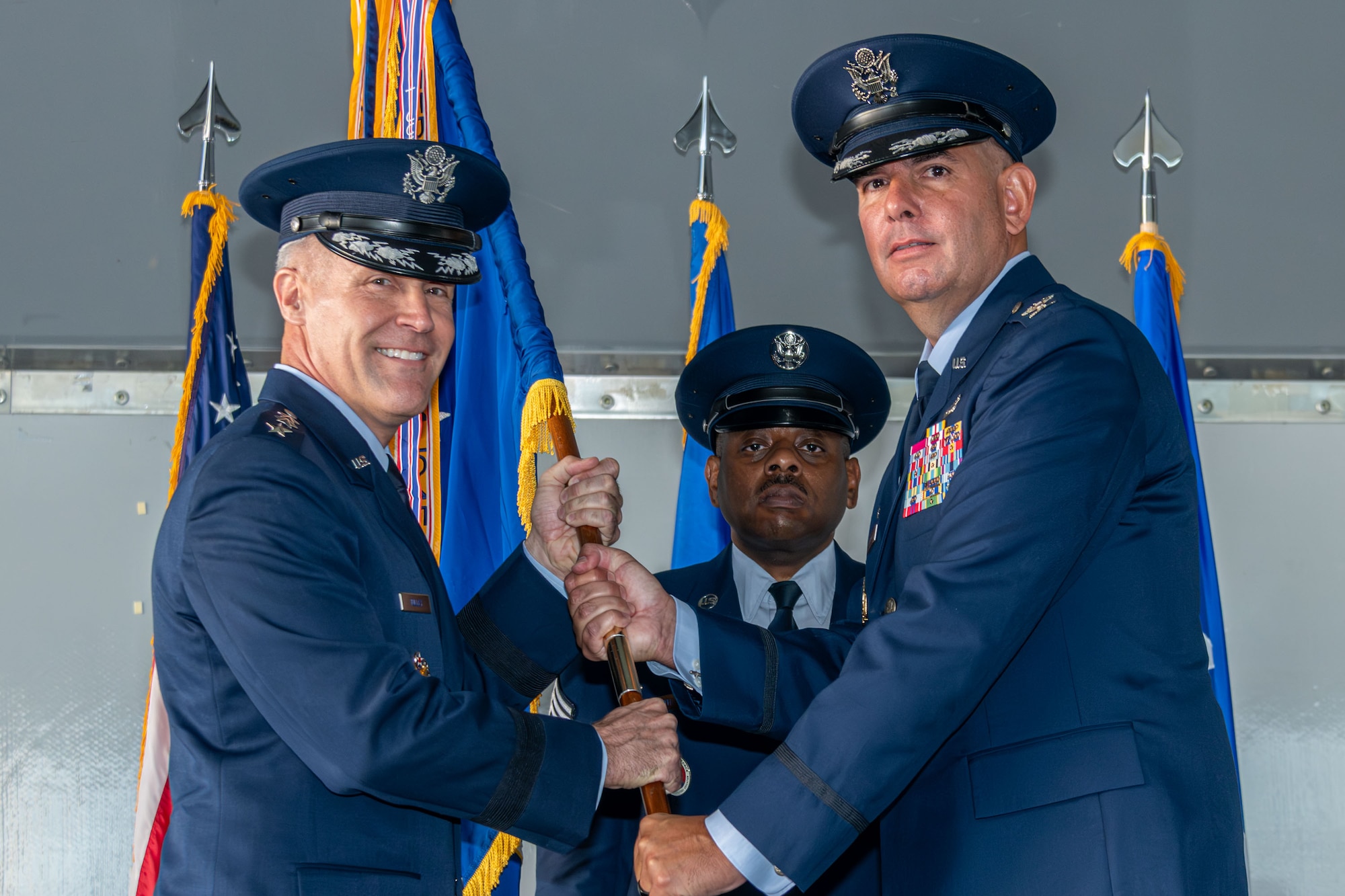 U.S. Air Force Lt. Gen. Daniel H. Tulley, commander and president of Air University, passes the guidon to U.S. Air Force Col. Michael Gallucci, incoming commander of the 42d Air Base Wing, during the wing’s change of command ceremony at Maxwell Air Force Base, Alabama, Jun 6, 2026. The education and training of our Nation’s fighting forces are critical to the mission success as Team 42 prides itself on providing excellent combat support to Air University and Air Education and Training Command. (U.S. Air Force photo by Trey Ward)