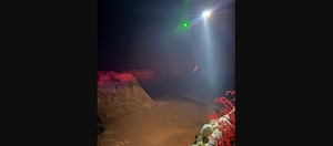 A U.S. Coast Guard Air Station San Francisco MH-65 Dolphin aircrew rescues three people from a cave near Santa Cruz, California, May 17, 2026. Air crew members hoisted all three individuals and transferred them to the care of nearby CAL FIRE and Santa Cruz County Fire personnel for further evaluation. (U.S. Coast Guard photo by Petty Officer 2nd Class Thomas Sizer)