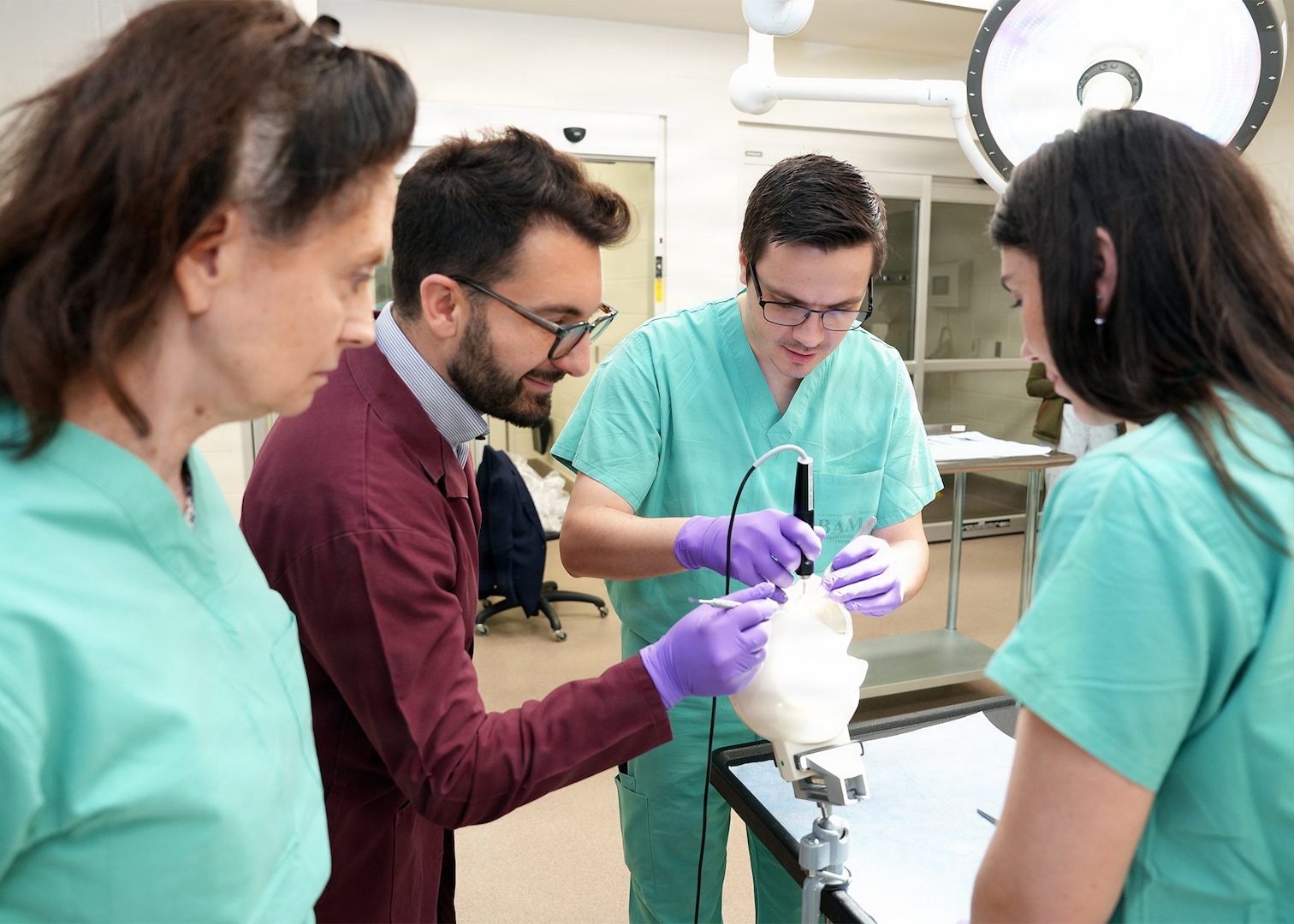 Joint Base San Antonio-Fort Sam Houston (May 15, 2026) Daniel Thompson, a research scientist assigned to Naval Medical Research Unit (NAMRU) San Antonio, uses a new ultrasonic applicator for BoneTape resorbable fracture stabilization implant on an artificial skull at the Battlefield Health and Trauma Research Institute. Cohesys, producer of BoneTape, conducted a demonstration of their new ultrasonic applicator for BoneTape and a separate pilot study with oral surgeons from the Uniformed Services University and Brooke Army Medical Center to gather user feedback to support their upcoming U.S. Food and Drug Administration submission. Part of Navy Medicine Research & Development, NAMRU San Antonio supports Navy Medicine’s efforts to deliver expeditionary medicine systems, increase Sailor and Marine deployability, provide quality healthcare and recruit and retain medical personnel through gap-driven combat casualty care, craniofacial and directed energy research. Navy Medicine’s 44,000+ talented and ready forces optimize health readiness, deliver quality healthcare, and provide global expeditionary medical support to warfighters. (U.S. Navy Photo by Burrell Parmer /Released)