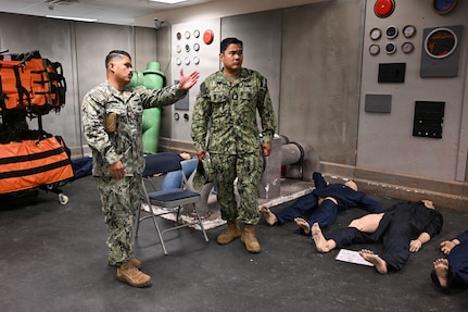 U.S. Navy Hospital Corpsman 1st Class Carlojelo Tarray, an instructor with the hospital corpsman basic program at the Medical Education and Training Campus, speaks to U.S. Navy Bureau of Medicine and Surgery Force Master Chief Jerry Cantorna, director, Hospital Corps, during a visit to Navy Medicine Training Support Command, June 2, 2026. Cantorna’s visit to NMTSC emphasized Navy Medicine’s focus on the health, warfare, and training of Sailors and Marines. (U.S. Navy photo Mass Communication Specialist 1st Class Shayla D. Hamilton)