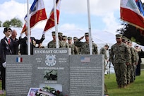 U.S. Navy Color Guard of Naval Forces Europe/Africa stand in formation to honor the memory of both Jack Hamlin and members of Flotilla One.