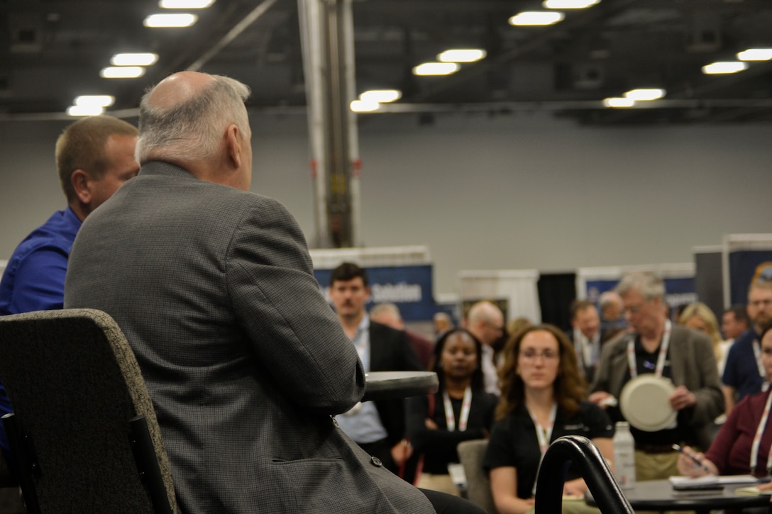 Industry and government logistics professionals listen as DLA Troop Support leadership answers questions during a "knowledge bar" session at the DLA Supply Chain Alliance Symposium & Exhibition in Columbus, Ohio, June 3, 2026. The interactive setting allowed small and large businesses to gain direct insights into doing business with the agency.