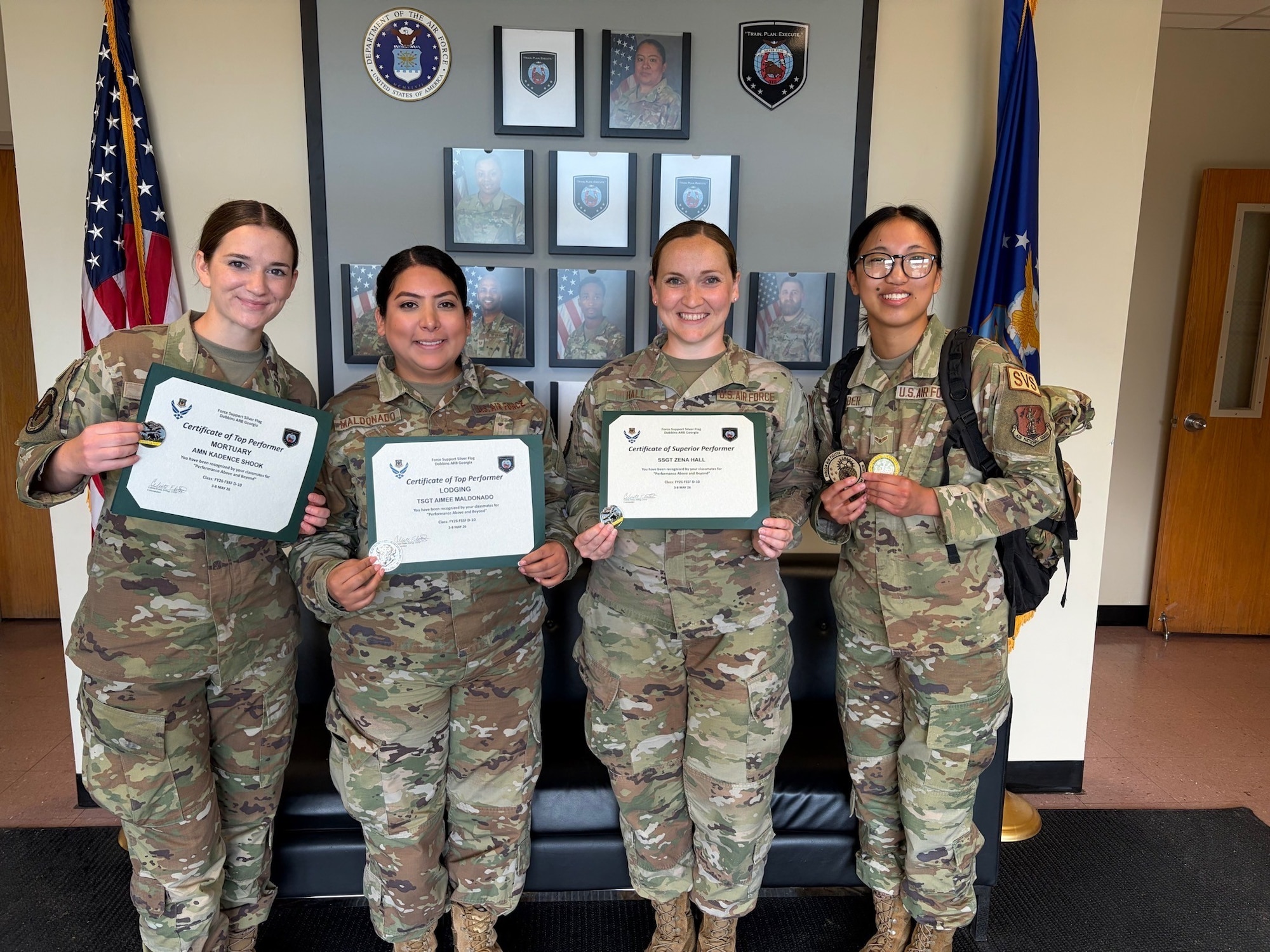 Members assigned to the184th Force Support Squadron are recognized for their performance during the Force Support Silver Flag training event at Dobbins Air Reserve Base, Ga., May 8. Pictured from left are Airman Kadence Shook, top performer; Tech. Sgt. Aimee Maldonado, top performer; Staff Sgt. Zena Hall, superior performer; and Airman 1st Class Jaidalyn Gerber.