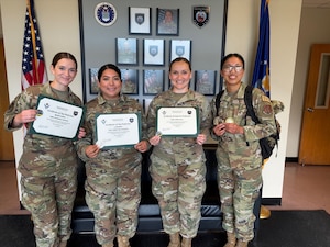 Members assigned to the184th Force Support Squadron are recognized for their performance during the Force Support Silver Flag training event at Dobbins Air Reserve Base, Ga., May 8. Pictured from left are Airman Kadence Shook, top performer; Tech. Sgt. Aimee Maldonado, top performer; Staff Sgt. Zena Hall, superior performer; and Airman 1st Class Jaidalyn Gerber.