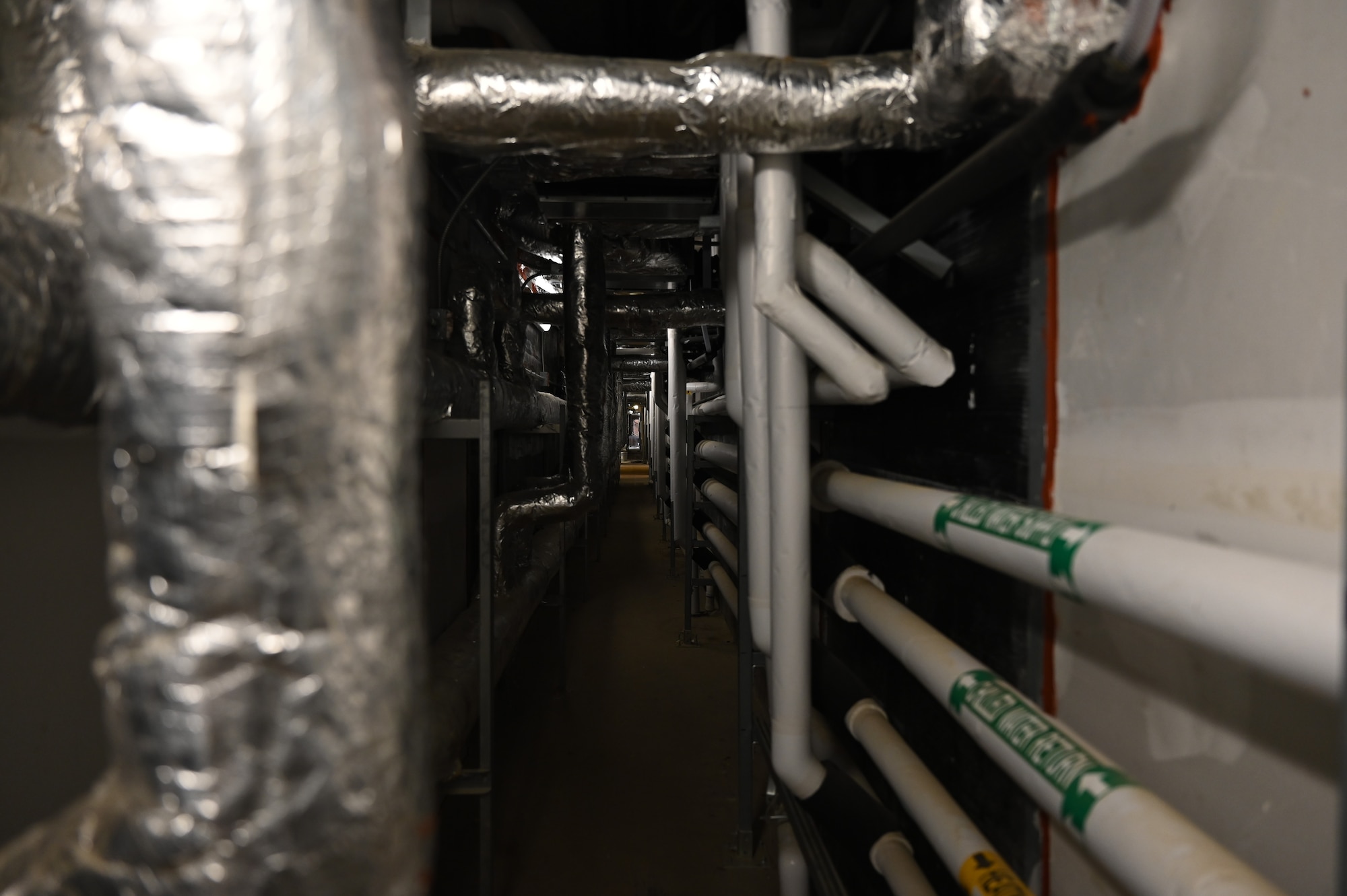 A long shot of the mechanical corridor