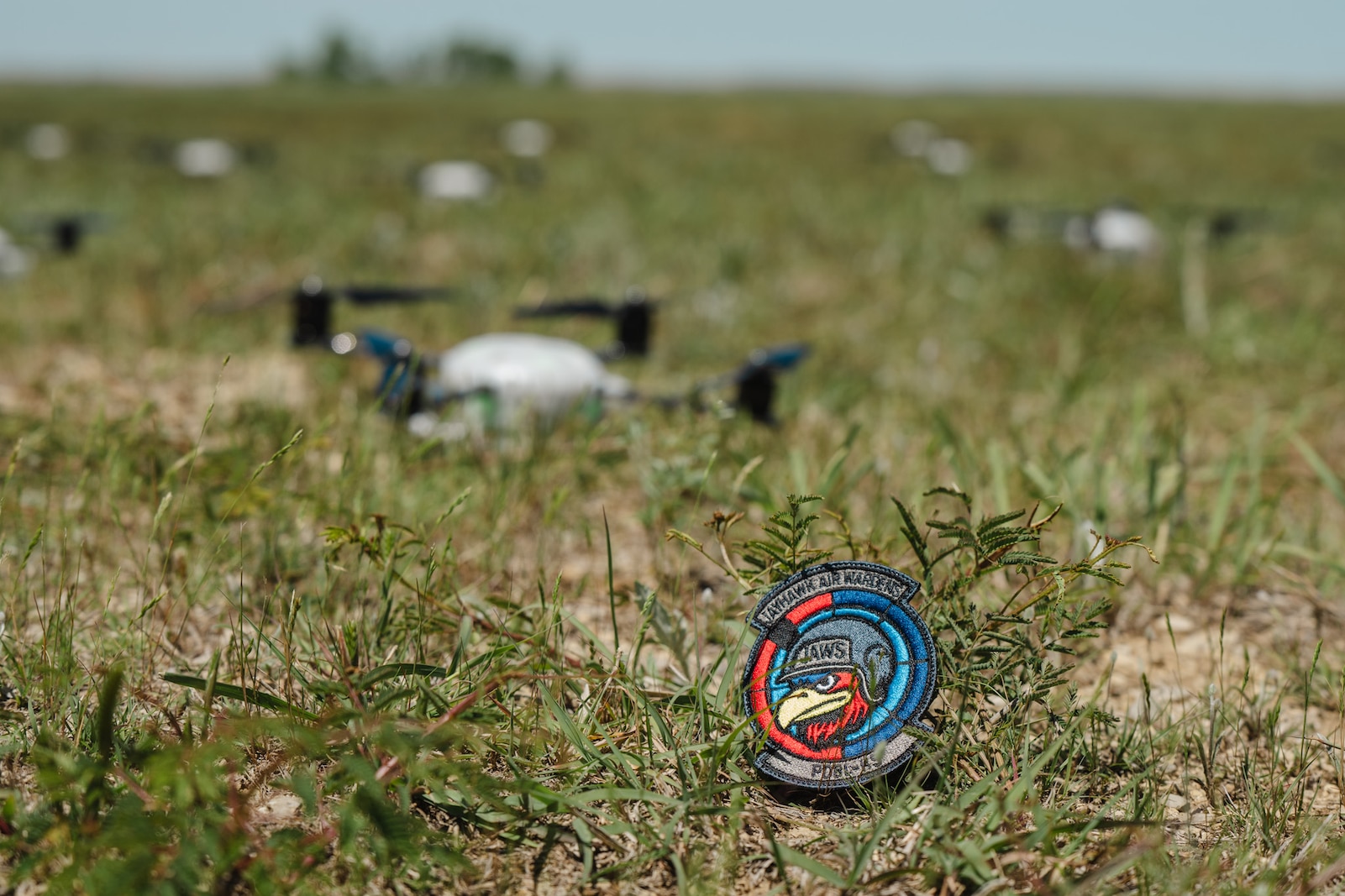 Airmen assigned to the 184th Wing’s Point Defense Battle Lab test autonomous drone swarm capabilities during a live demonstration at Smoky Hill Air National Guard Range near Salina, Kansas, May 7, 2026. Working alongside the PDBL, industry partners demonstrated how they can successfully coordinate up to 1,000 Group 1 unmanned aerial systems (UAS) using a single ground control operator, further showcasing how rapid innovation can counter emerging airborne threats. The demonstration supports Air Combat Command's ongoing initiative to develop tactics and procedures for countering small UAS. (U.S. Air National Guard photo by 1st Lt. Samantha Root)