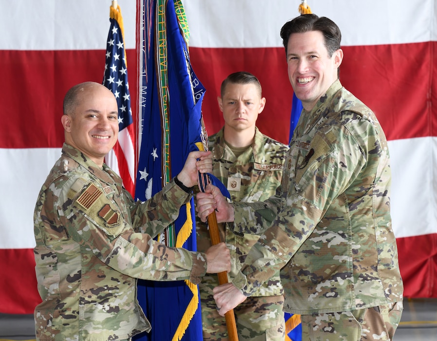 Air Force Colonel gives 55th Wing guidon to new 55th Wing command chief