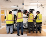 Workers at U.S Naval Hospital Guam (USNH Guam) install a new Revolution Ascend Plus 72 kilowatt computed tomography (CT) scanner, Feb. 13. A second unit, the Revolution Apex platform, is also scheduled for installation in the coming months as part of a planned modernization effort at the hospital. (U.S. Navy photo by Hospital Corpsman First Class Clien Lester Guico)