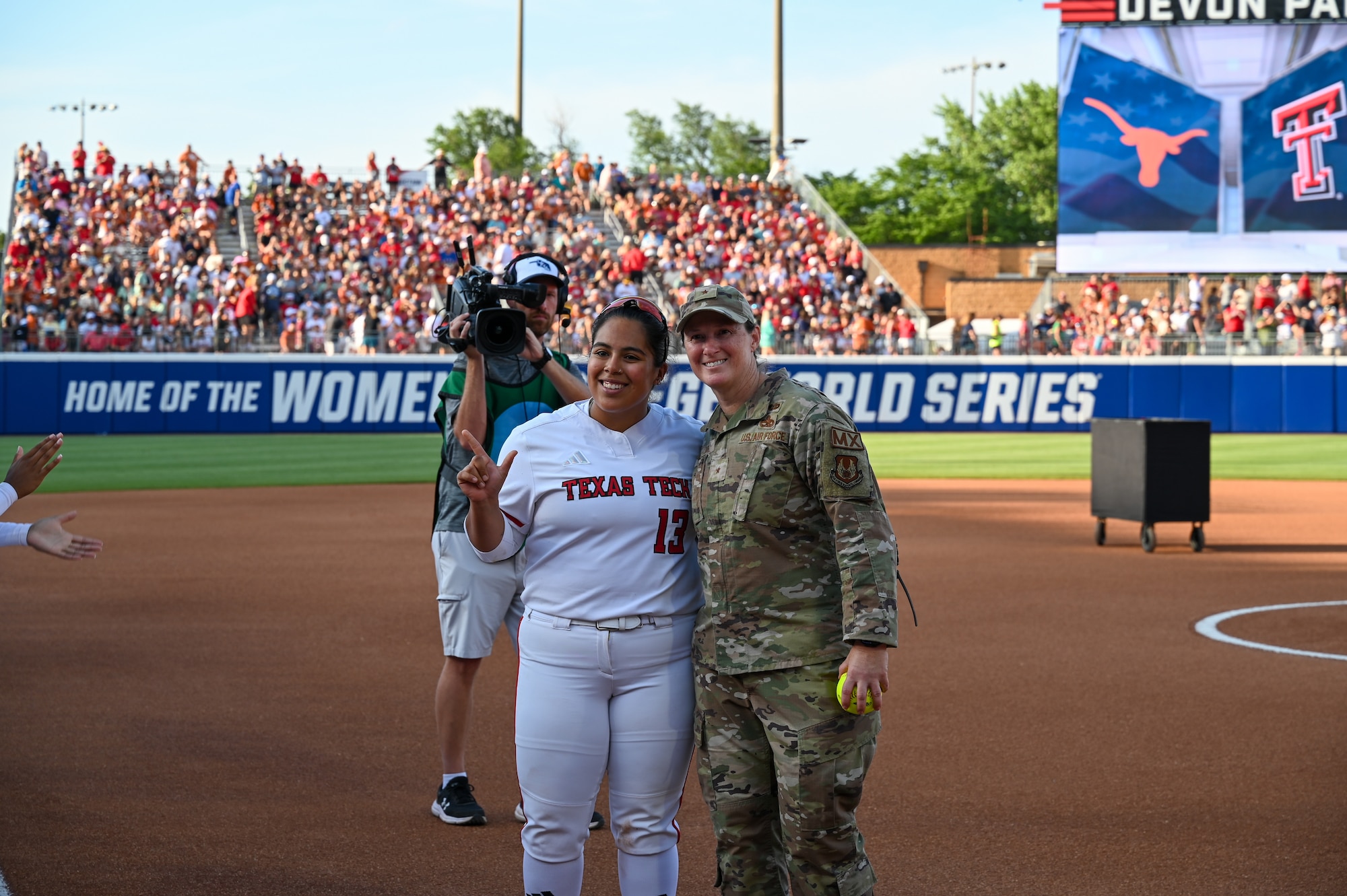 Commander poses after first pitch