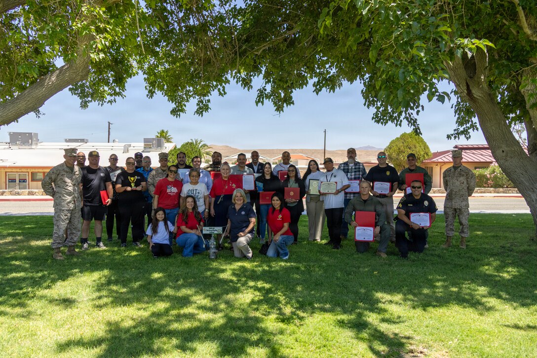Military and civilian personnel enjoyed a full day of activities for Employee Recognition Day aboard Marine Corps Logistics Base Barstow, California, 4 June. The day featured tournaments in softball and pickleball, cornhole, indoor games, swimming, food, and much more. Amidst the celebrations, presentations for the 2nd Quarter Awards and the 3rd Quarter Length of Service Recognition were conducted, along with several other awards to acknowledge various personnel and departments for their dedication, hard work, and the appreciation shown for their contributions not just for a single day but throughout the entire year.  Congratulations NMCRS MCLB Barstow Thrift Store, the winner of the Bottles Up! Recycling Challenge
