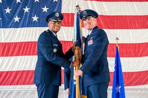 U.S. Air Force Col. Michael Mullin, right, assumes command of the 49th Wing, from Maj. Gen. Roy W. Collins, Air Education and Training Command deputy commander, during a change of command ceremony at Holloman Air Force Base, New Mexico, June 4, 2026. The change of command ceremony is an American military tradition deeply rooted in history, signifying the authority of the incoming commander. (U.S. Air Force photo by Senior Airman Michelle Ferrari)