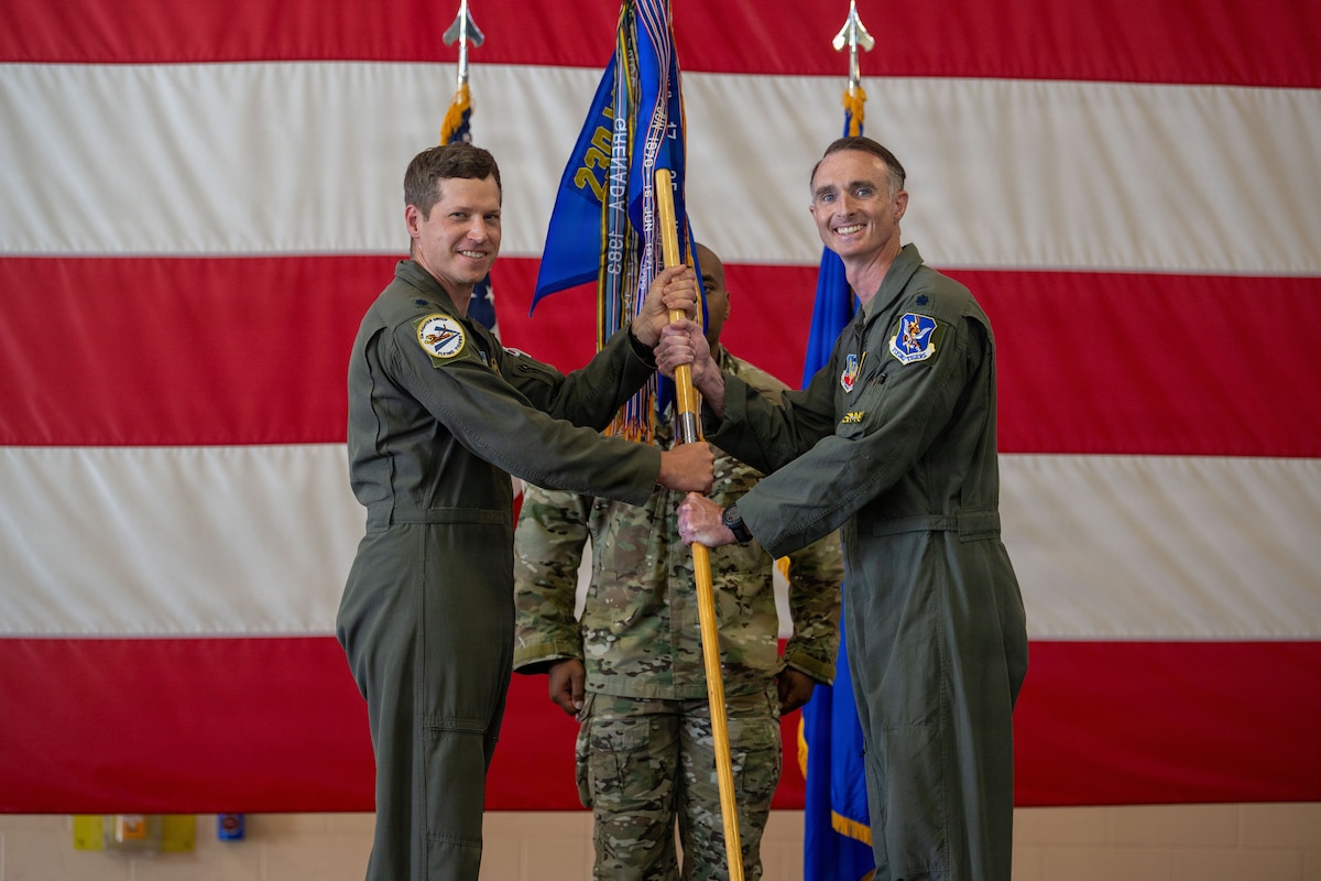U.S. Air Force Lt. Col. Christopher J. Anthony, left, 23d Fighter Group deputy commander, passes a guidon to Lt. Col. Eric T. LaPrade, the new 23d Operations Support Squadron commander, during a change of command ceremony at Moody Air Force Base, Georgia, Jun. 5, 2026. The passing of the guidon symbolizes the preservation of military heritage and the seamless transition of leadership that has strengthened America's armed forces for 250 years. (U.S. Air Force photo by Senior Airman Iain Stanley)