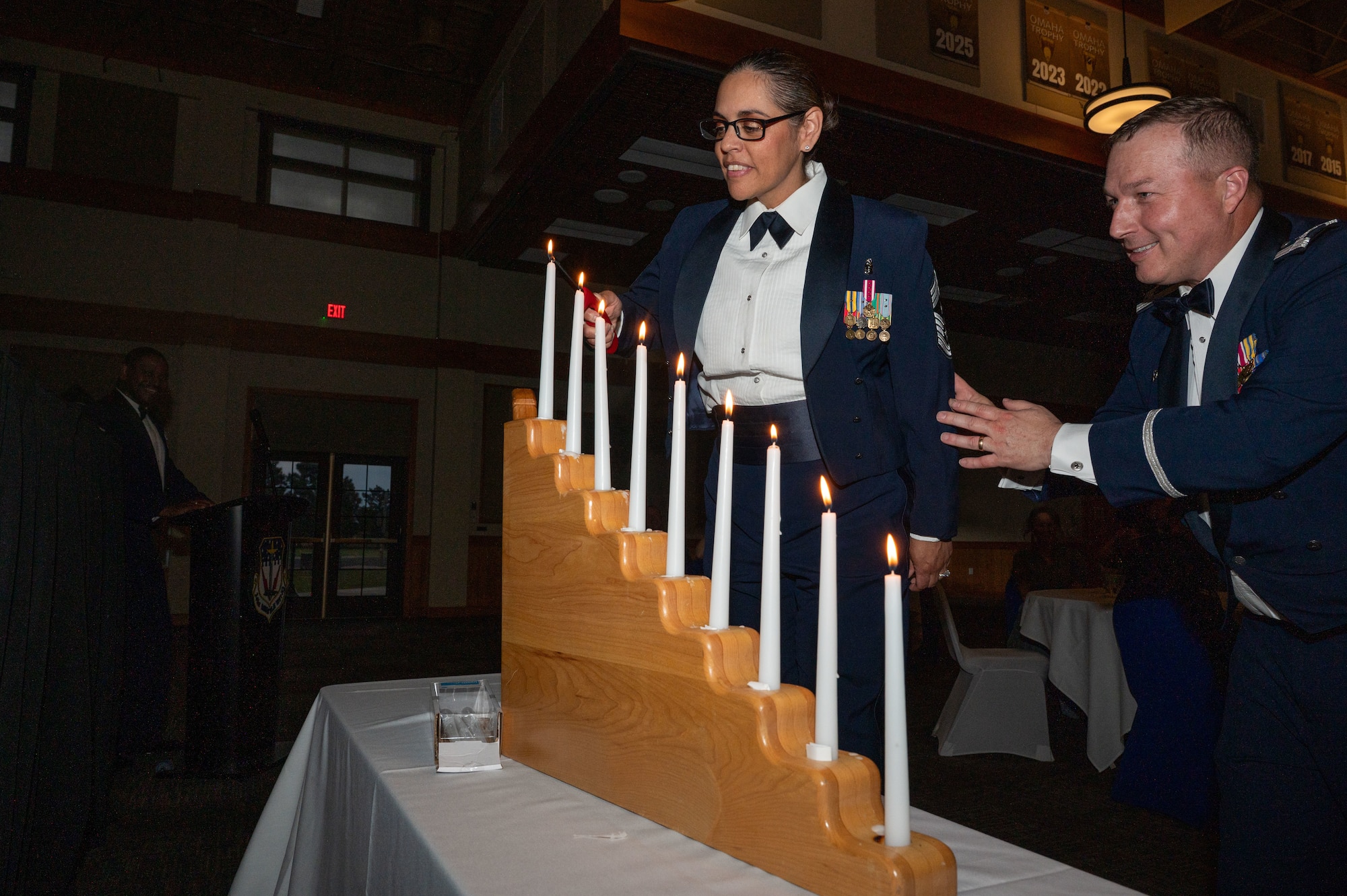 U.S. Air Force Chief Master Sgt. Lisa Thrasher-Stallard, 341st Missile Wing command chief, lights her respective rank’s candle in a candle lighting ceremony during the 2026 Chief Master Sgt. Recognition ceremony at Malmstrom Air Force Base, Montana, May 29, 2026.