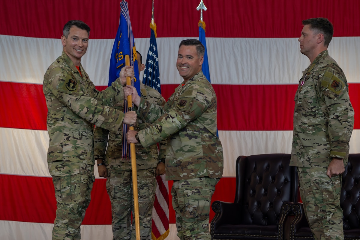 Commander passes the guidon onto someone else.