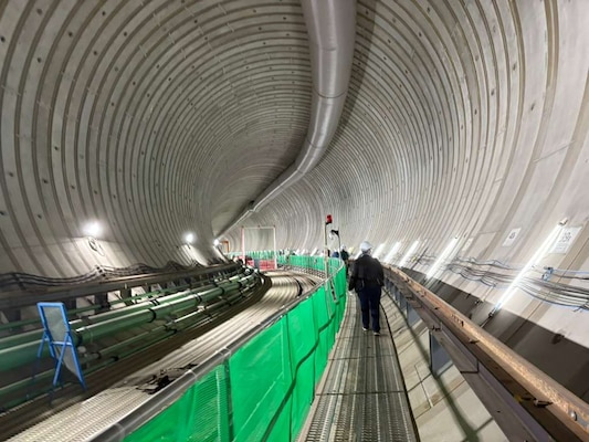 Japanese engineers inside a massive subterranean water tank