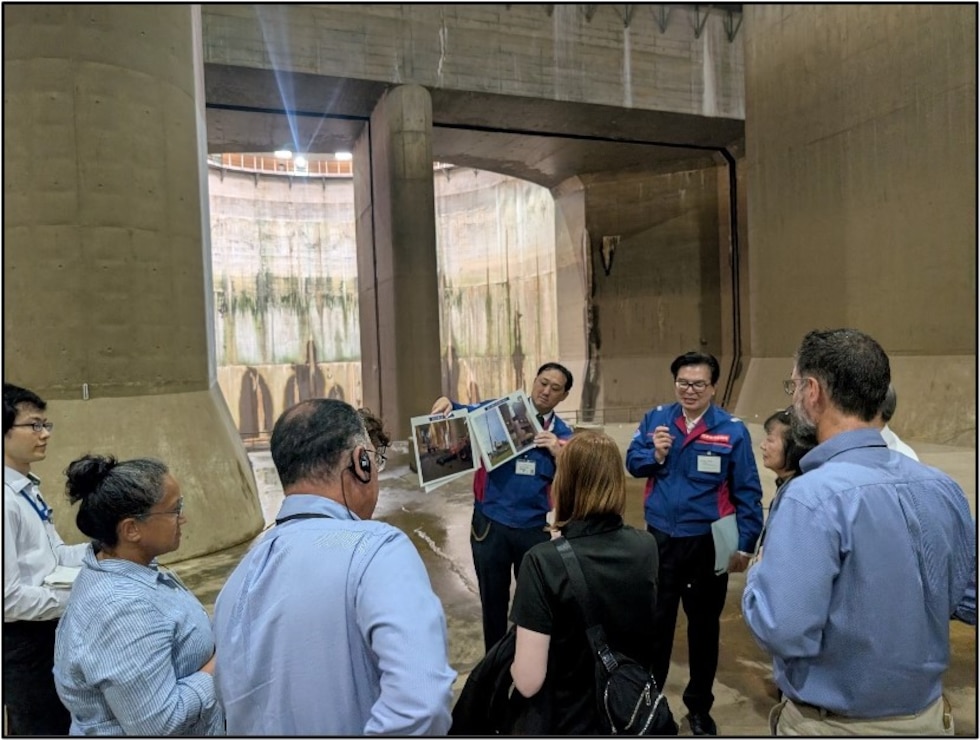Japanese engineers discussing water resource challenges