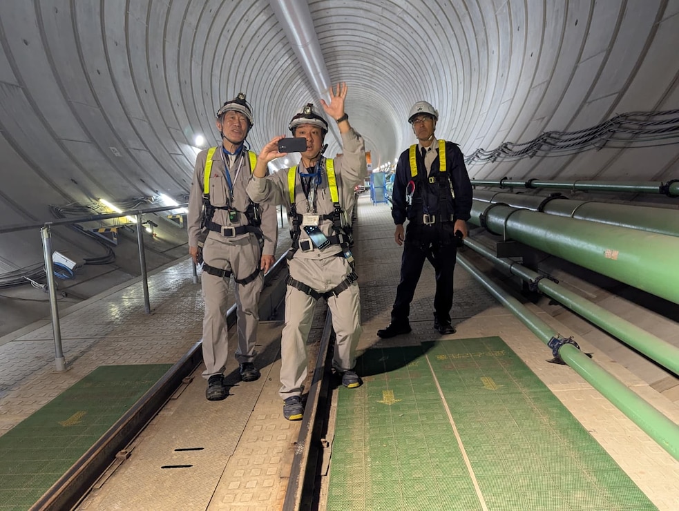Japanese engineers discussing water resource challenges