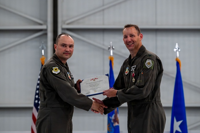 commander receives merit medal