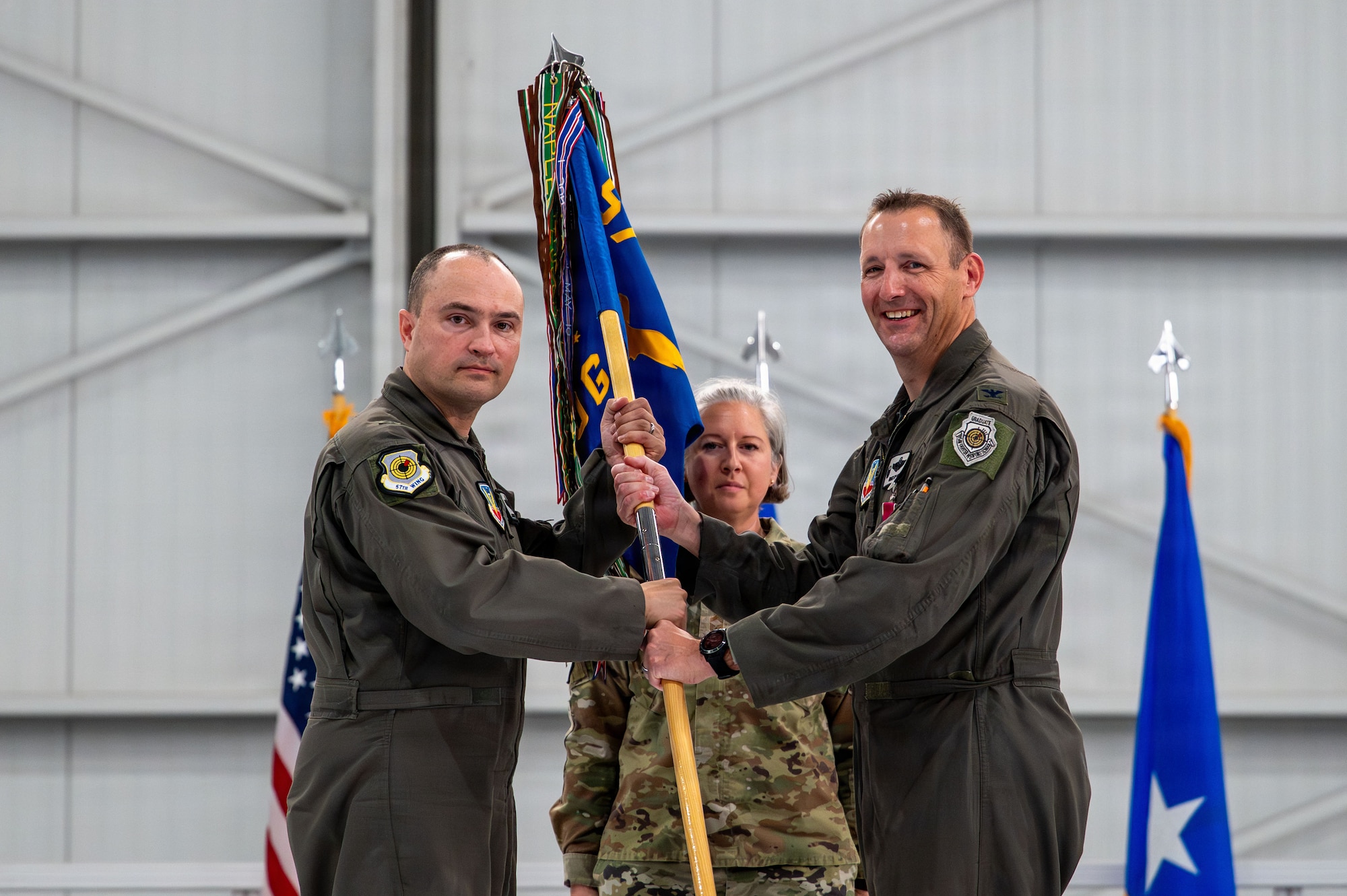 outgoing commander gives back guidon