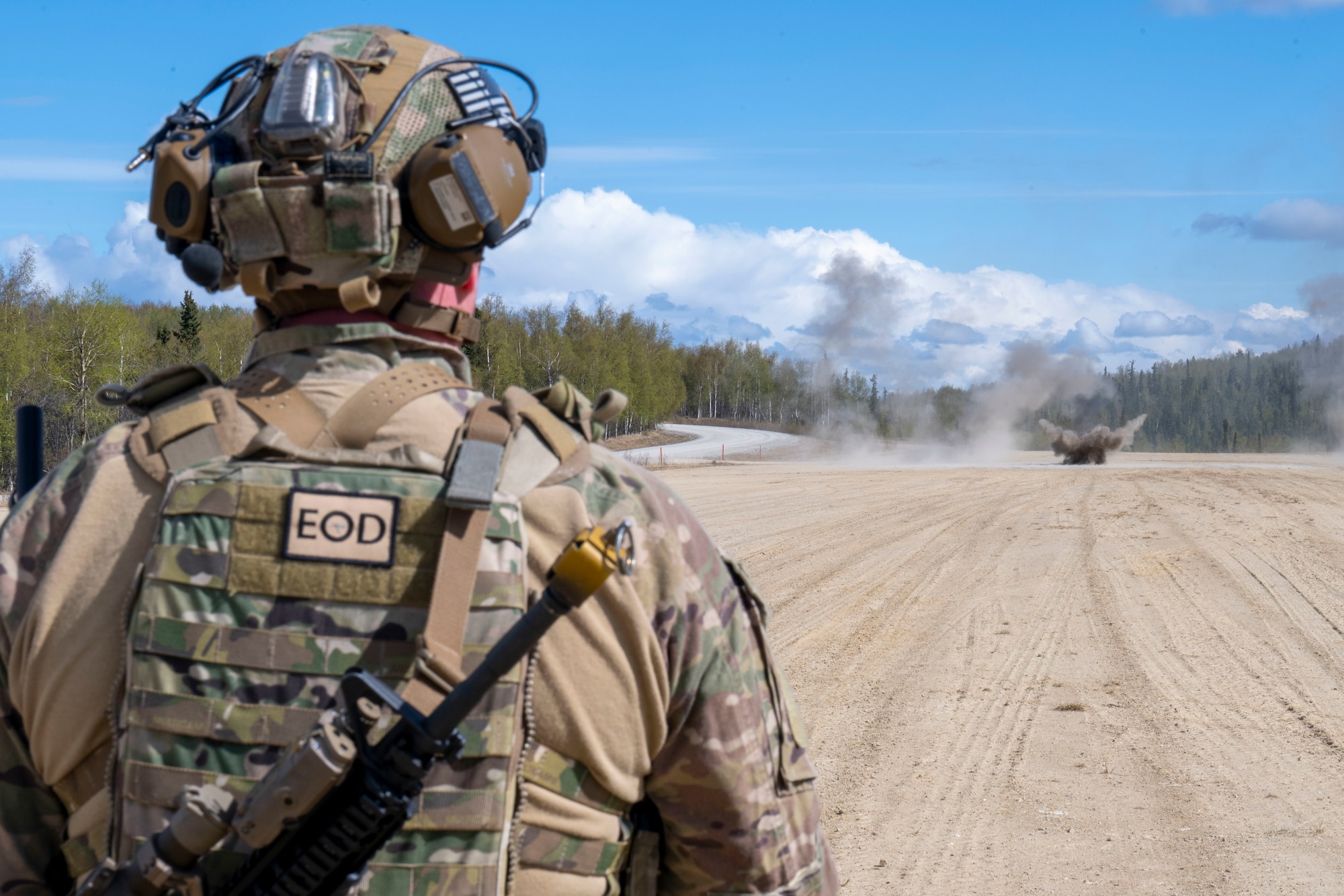 Staff Sgt. Edward Kajko, 354th Civil Engineer Squadron explosive ordnance disposal team member, watches as explosives go off during an Agile Moose drill at Eielson Air Force Base, Alaska, May 28, 2026.