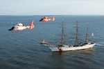 Two Coast Guard Air Station Savannah MH-65 Dolphin helicopters fly in formation March. 15, 2019, as the Cutter Eagle transits down the Savannah River towards Savannah, Georgia. Air Station Savannah welcomed the Eagle crew as they arrived in Savannah for St. Patrick’s Day weekend. (U.S. Coast Guard photo by Petty Officer 3rd Class Ryan Dickinson)