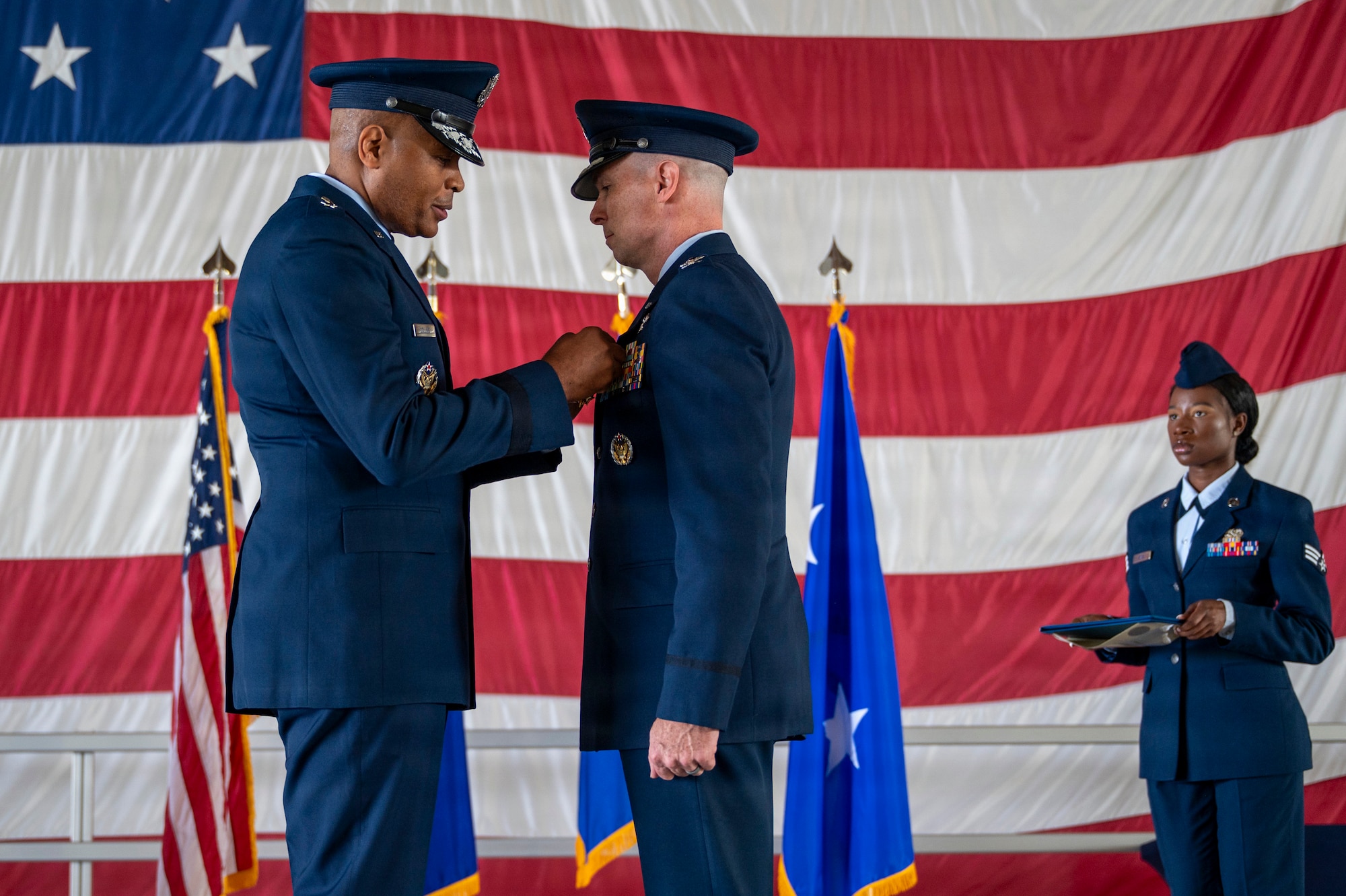 U.S. Air Force Col. John Ethridge, 49th Wing commander, right, receives the Legion of Merit Medal from Maj. Gen. Roy W. Collins, Air Education and Training Command deputy commander, during a change of command ceremony at Holloman Air Force Base, New Mexico, June 4, 2026. The Legion of Merit is a distinguished U.S. military award presented for exceptionally meritorious conduct and outstanding service in key positions of responsibility, uniquely conferred upon both American service members and foreign military or civilian personnel. (U.S. Air Force photo by Senior Airman Michelle Ferrari)