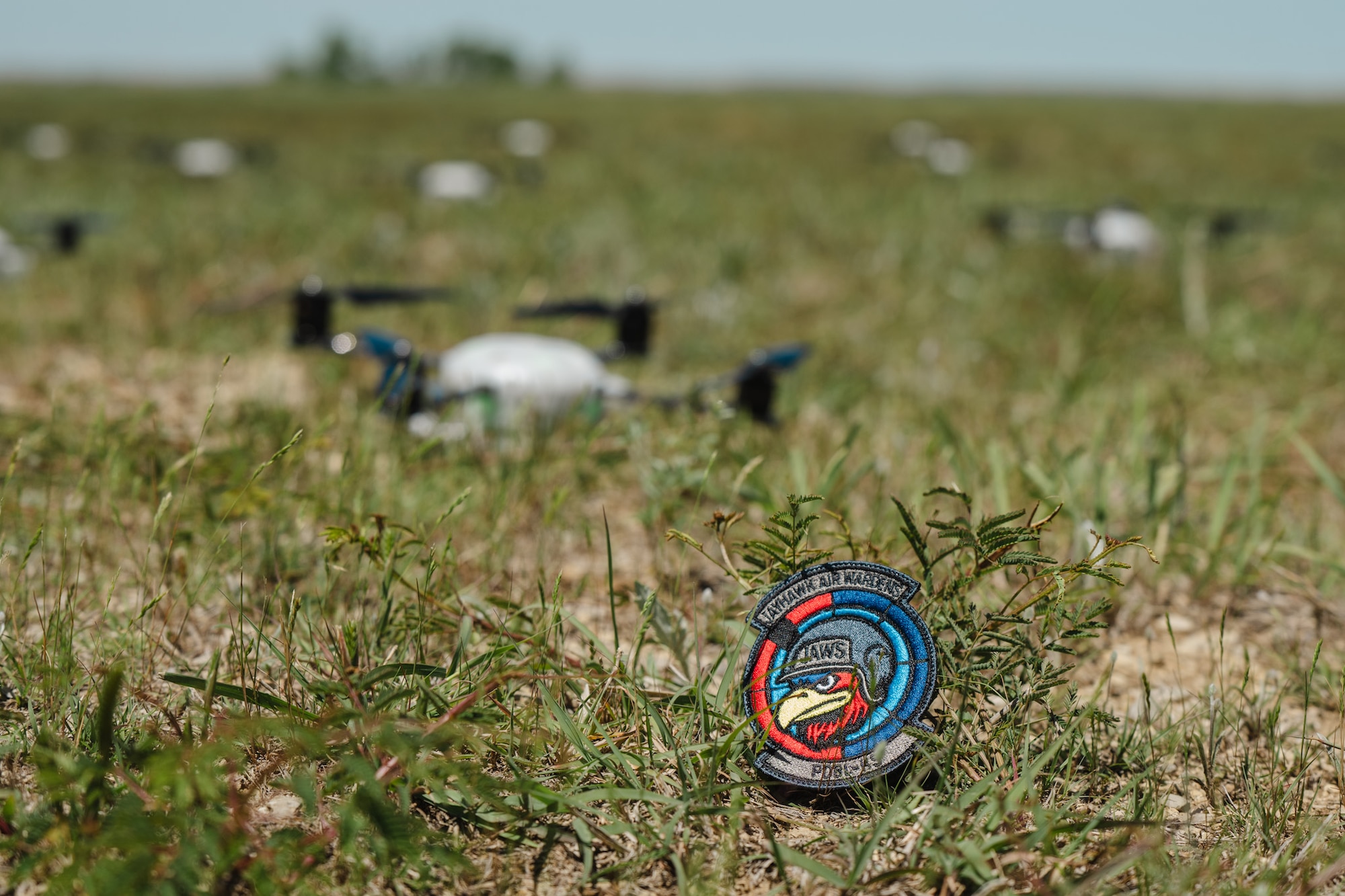 Airmen assigned to the 184th Wing’s Point Defense Battle Lab test autonomous drone swarm capabilities during a live demonstration at Smoky Hill Air National Guard Range near Salina, Kansas, May 7, 2026. Working alongside the PDBL, industry partners demonstrated how they can successfully coordinate up to 1,000 Group 1 unmanned aerial systems (UAS) using a single ground control operator, further showcasing how rapid innovation can counter emerging airborne threats. The demonstration supports Air Combat Command's ongoing initiative to develop tactics and procedures for countering small UAS. (U.S. Air National Guard photo by 1st Lt. Samantha Root)