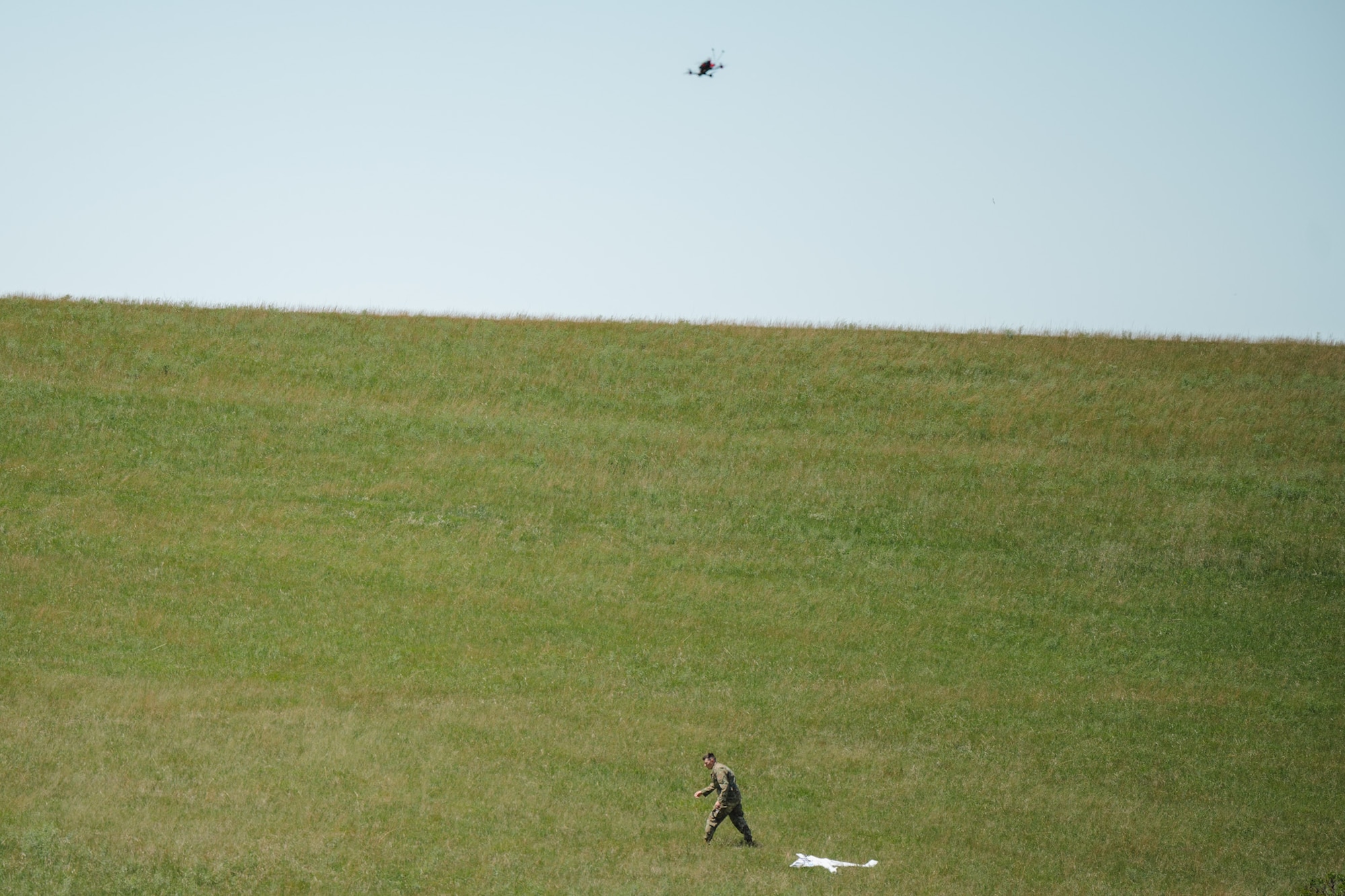 Airmen assigned to the 184th Wing’s Point Defense Battle Lab test autonomous drone swarm capabilities during a live demonstration at Smoky Hill Air National Guard Range near Salina, Kansas, May 7, 2026. Working alongside the PDBL, industry partners demonstrated how they can successfully coordinate up to 1,000 Group 1 unmanned aerial systems (UAS) using a single ground control operator, further showcasing how rapid innovation can counter emerging airborne threats. The demonstration supports Air Combat Command's ongoing initiative to develop tactics and procedures for countering small UAS. (U.S. Air National Guard photo by 1st Lt. Samantha Root)