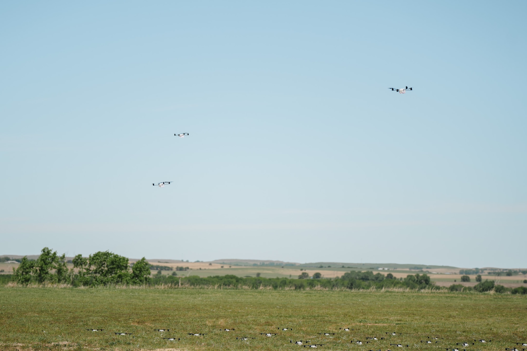 Airmen assigned to the 184th Wing’s Point Defense Battle Lab test autonomous drone swarm capabilities during a live demonstration at Smoky Hill Air National Guard Range near Salina, Kansas, May 7, 2026. Working alongside the PDBL, industry partners demonstrated how they can successfully coordinate up to 1,000 Group 1 unmanned aerial systems (UAS) using a single ground control operator, further showcasing how rapid innovation can counter emerging airborne threats. The demonstration supports Air Combat Command's ongoing initiative to develop tactics and procedures for countering small UAS. (U.S. Air National Guard photo by 1st Lt. Samantha Root)