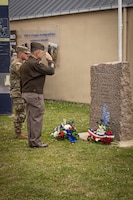 Maj. Gen. Patrick Ellis, commanding general of the 4th Infantry Division, and Spc. Rylee Parker, assigned to the  299th Brigade Engineer Battalion, 1st Stryker Brigade Combat Team, 4ID, pays honors during a D-Day 82 Memorial Ceremony, Quinéville, Normandy, June 05, 2026. The event memorialized the sacrifices of 4th Infantry Division Soldiers during the D-Day landings to liberate Europe from Nazi occupation. (U.S. Army photo by Sgt. William Rogers)