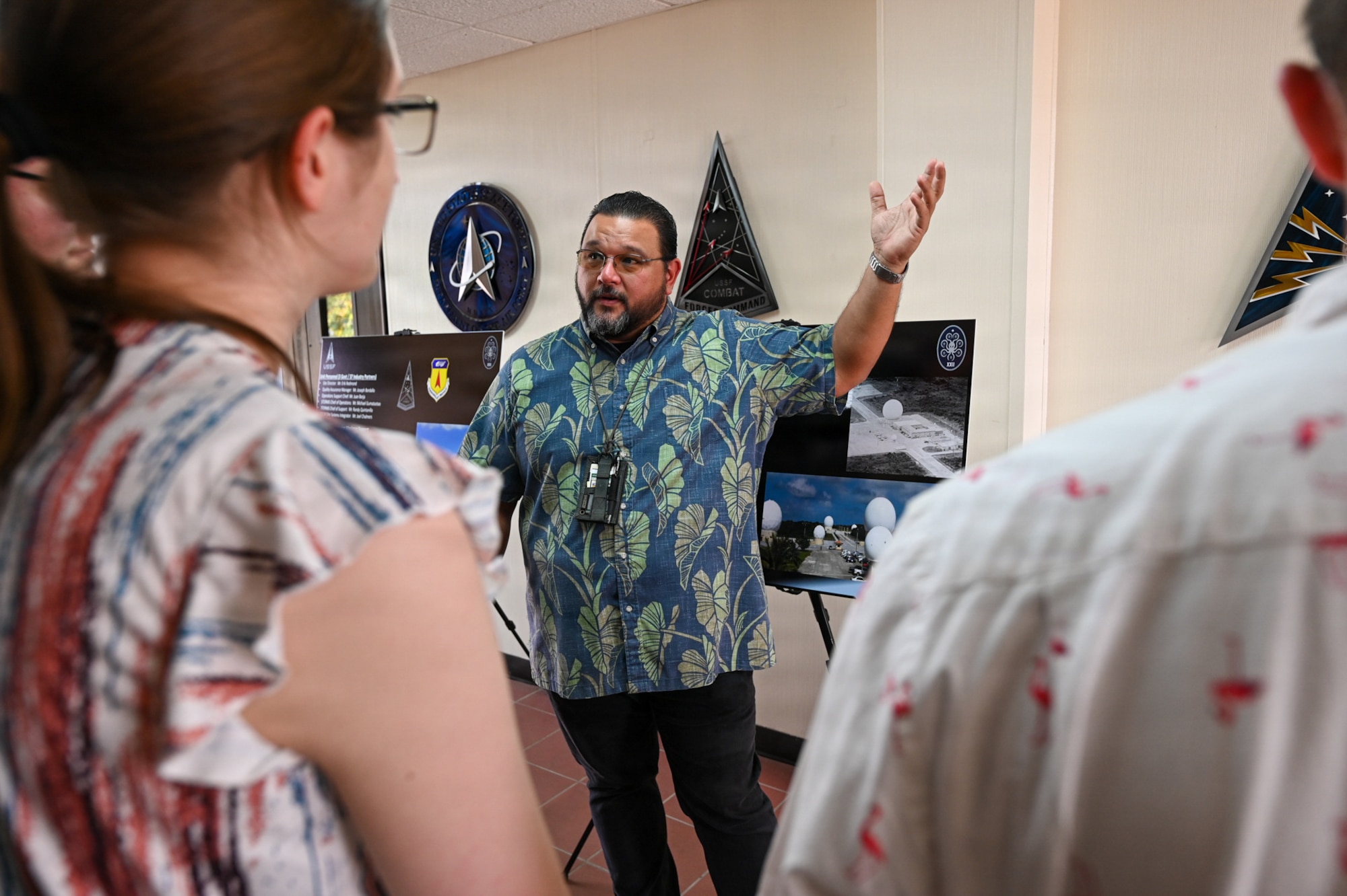 Erik Redmond, 22nd Space Operations Squadron (SOPS), Detachment 5 site director, briefs the Mississippi College tour group.