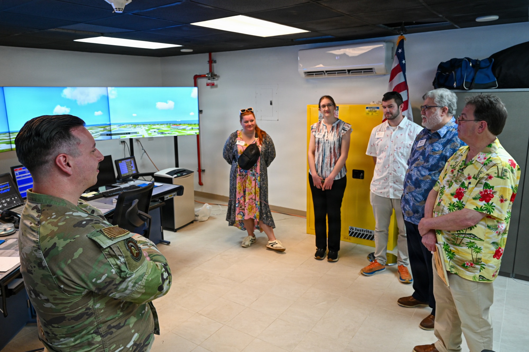 U.S. Air Force Staff Sgt. Noah Chapman, 36th Operations Support Squadron air traffic control tower specialist, briefs a tour group from Mississippi College.