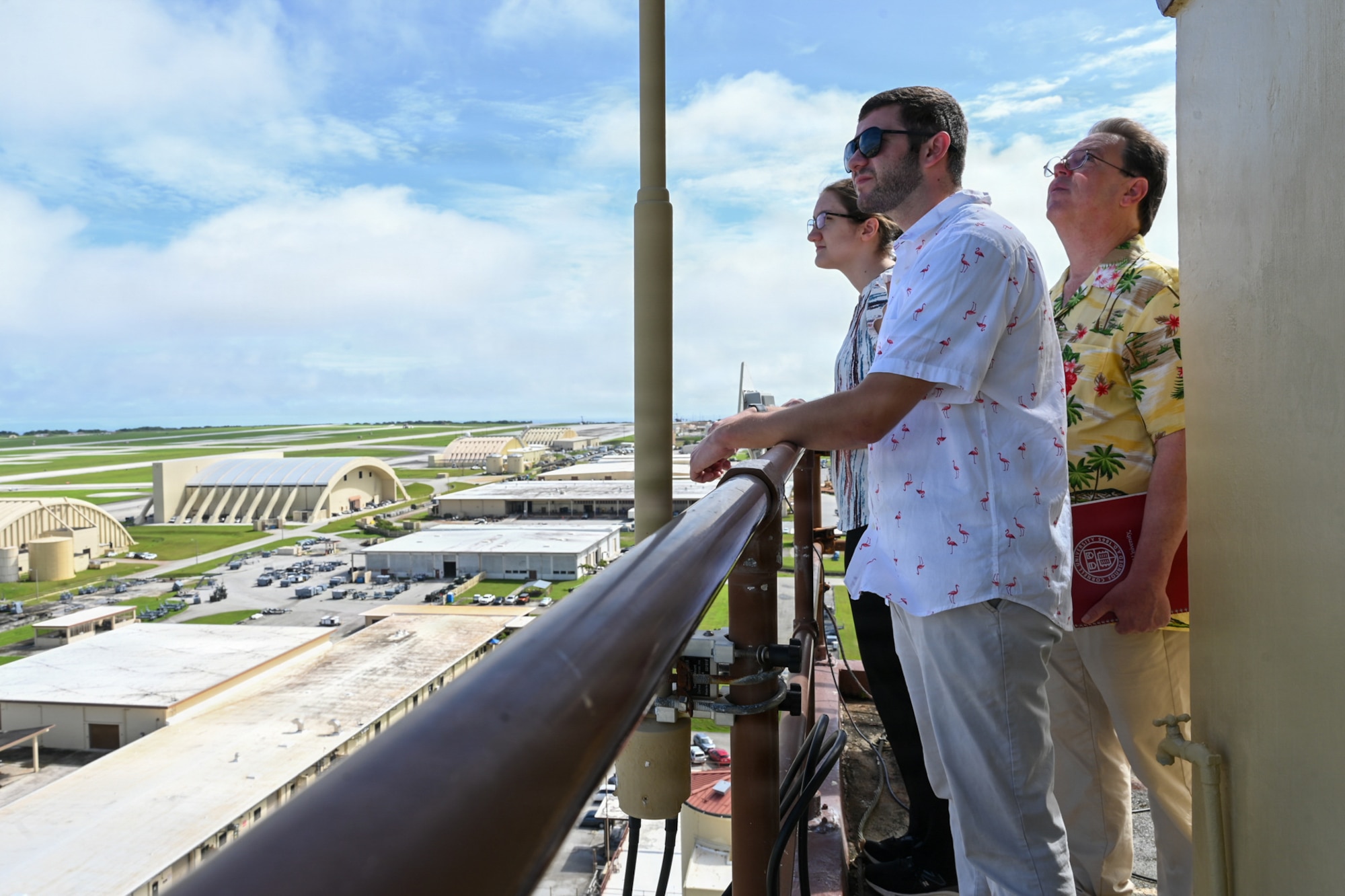 Participants from the Mississippi College tour group, view the flightline from the air traffic control tower catwalk.