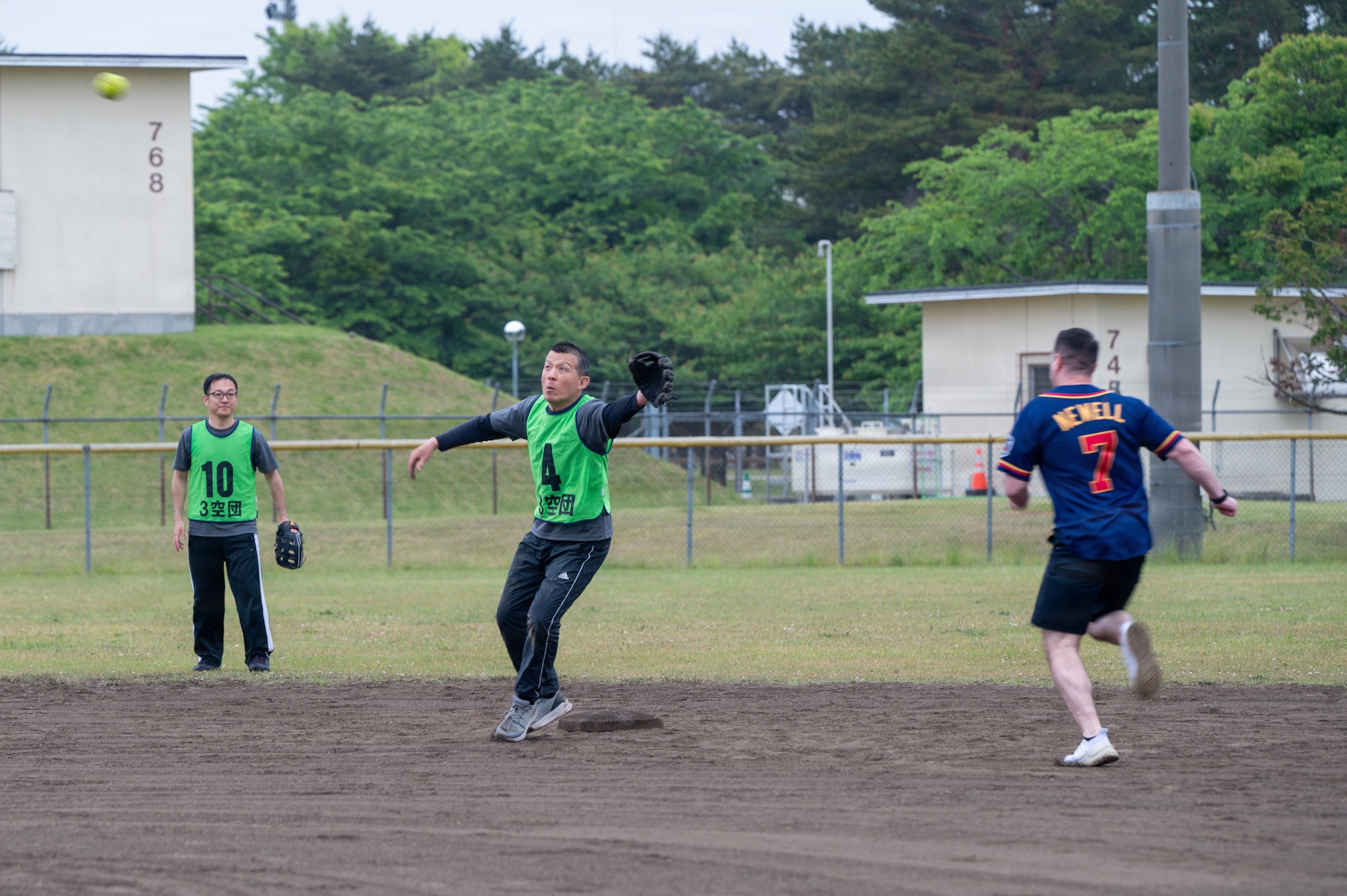 U.S. military and Japan Air Self-Defense Force members compete in a softball game during the 2026 Sakura Olympics