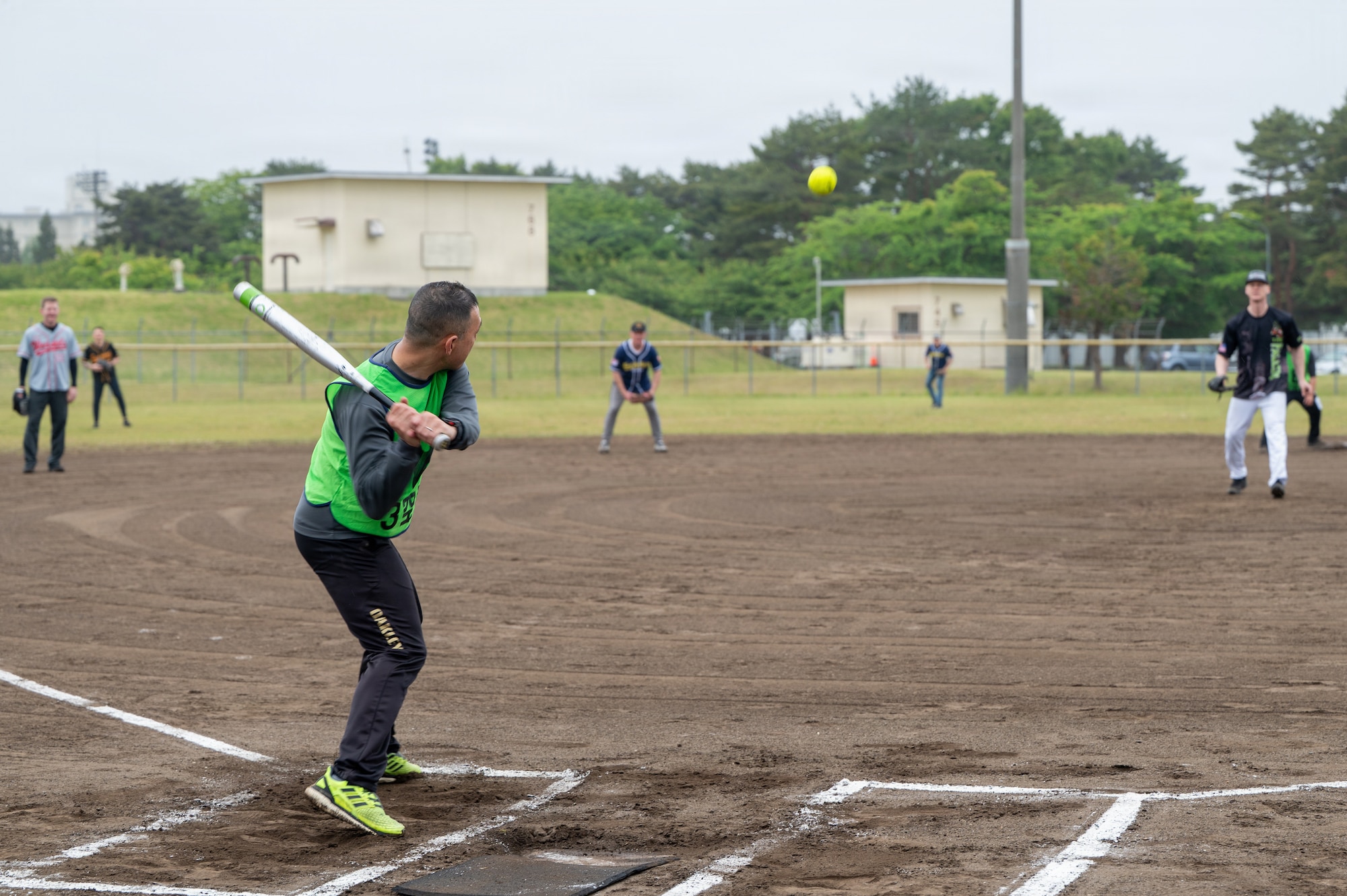 U.S. military and Japan Air Self-Defense Force members compete in a softball game during the 2026 Sakura Olympics